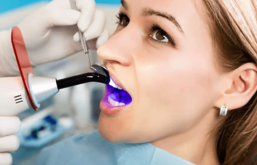 woman receiving dental bonding cosmetic dentistry Plano Texas